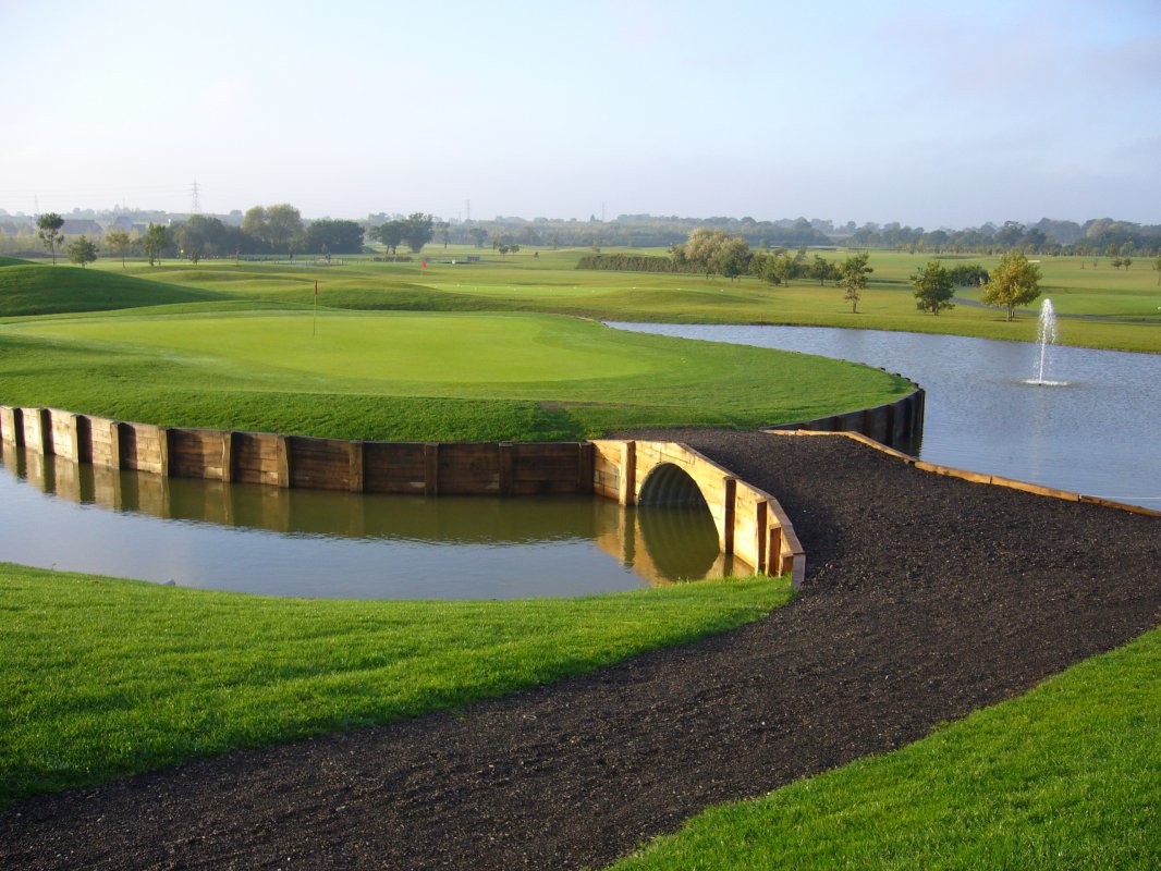 This stunning feature is surrounded by sparkling water, making for a truly unforgettable golfing experience.